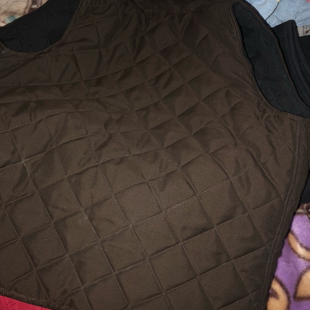 Unisex reversible brown and black vest.